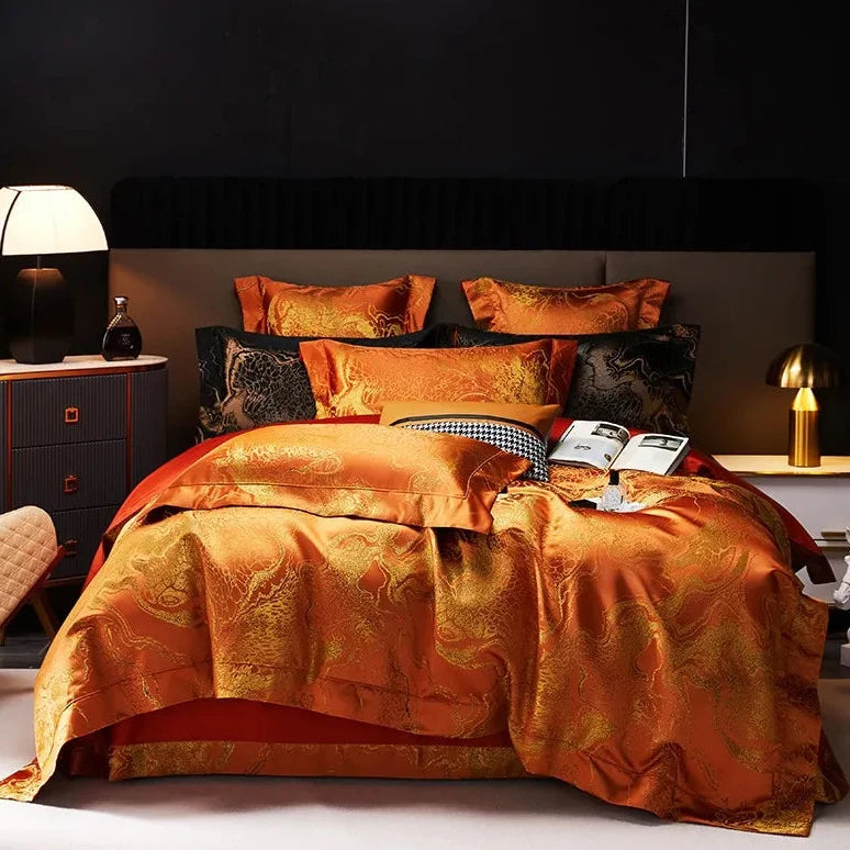 Burnt orange jacquard duvet cover set with ornate damask pattern and layered pillows in a luxury modern bedroom – L&B
