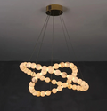 2-tier alabaster globe ring chandelier with a gold canopy and sculptural overlapping rings - L&B