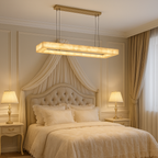 Alabaster Linear Chandelier Above Elegant Neutral Bedroom with Gold Canopy | BASPEAQ R. - L&B