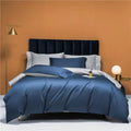 Slate blue and silver gray reversible Egyptian cotton duvet cover set styled on a modern bed – L&B
