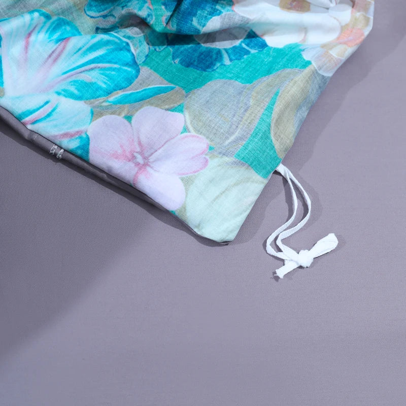 Interior corner tie detail on G. THE FLOWERS emerald botanical duvet cover with coordinating gray reverse – L&B