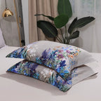 Stacked beige botanical pillow shams featuring colorful garden flowers and peacock details – L&B