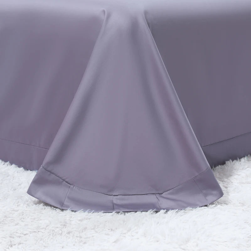 Coordinating solid gray flat sheet with softly draped edges for the emerald green floral bedding set – L&B