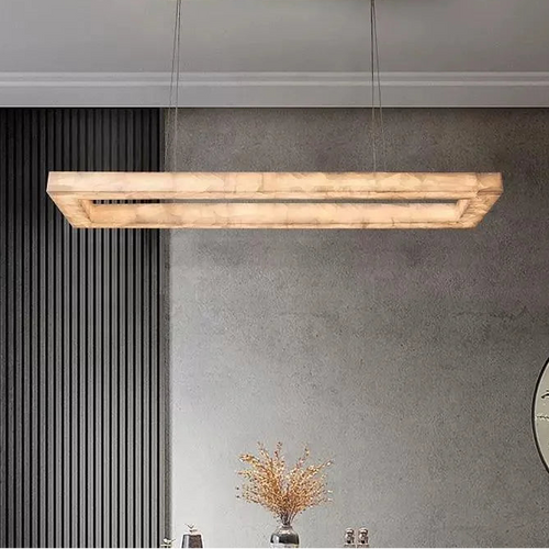 Modern alabaster linear chandelier with a rectangular frame and gold-finish ceiling canopy