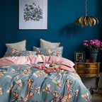 LIVELIC parrot botanical bedding styled against a deep teal wall with blush pink accents – L&B