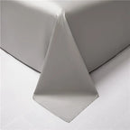 Silver gray reverse side of two-tone Egyptian cotton duvet cover shown draped, NESLLA BLUE GREY – L&B