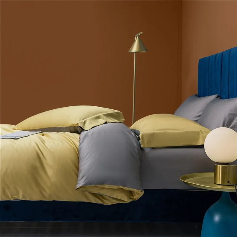 Reversible yellow and gray bedding displayed with contrasting pillow shams and solid-color styling – NESLLA YELLOW GREY – L&B