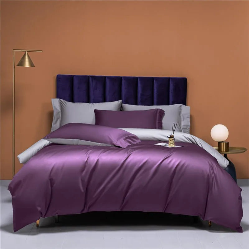 Purple reversible duvet cover set styled with silver gray pillows in a bold modern bedroom – NESLLA PURPLE GREY – L&B