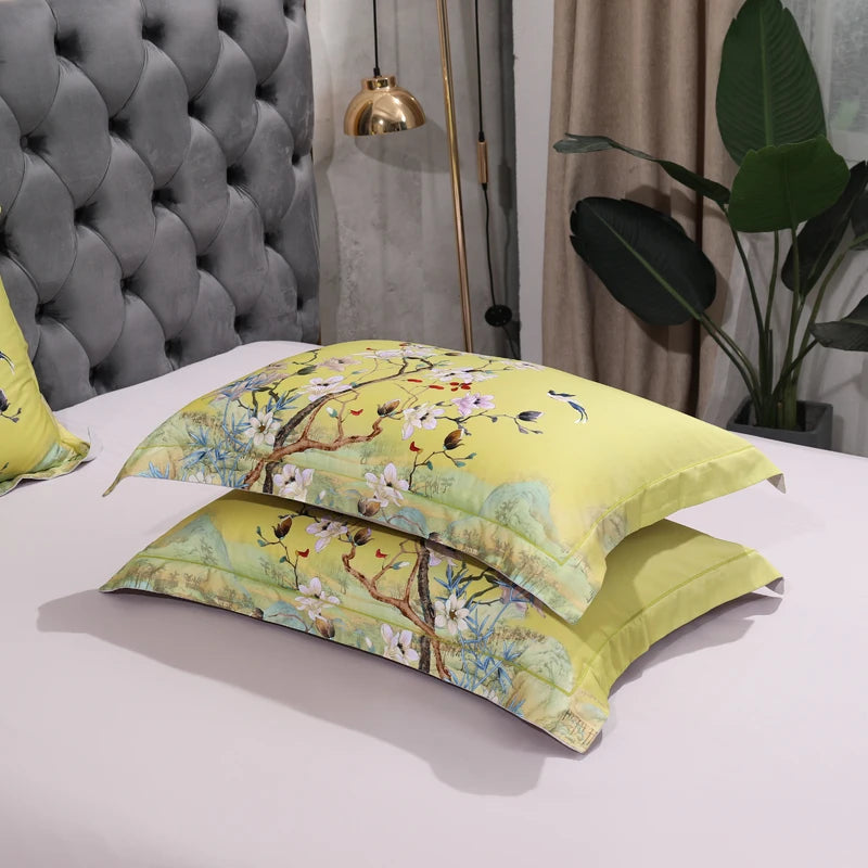 Stacked yellow floral pillow shams featuring painterly blossoming tree branches – L&B