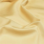 Close-up of smooth Golden yellow 800TC Egyptian cotton fabric with soft flowing folds – NESLLA YELLOW GREY – L&B