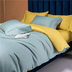 Reversible blue and yellow bedding folded to reveal two contrasting solid-color sides – NESLLA SKY-BLUE YELLOW – L&B