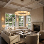 Ring alabaster chandelier in a warm transitional living room with a wood-beamed ceiling