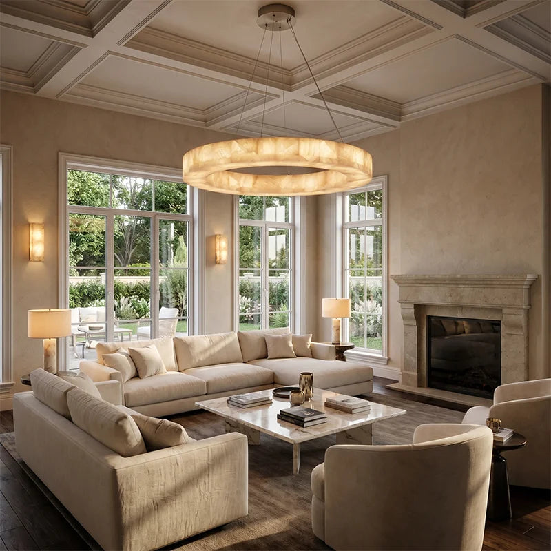 Ring alabaster chandelier in a warm transitional living room with a wood-beamed ceiling