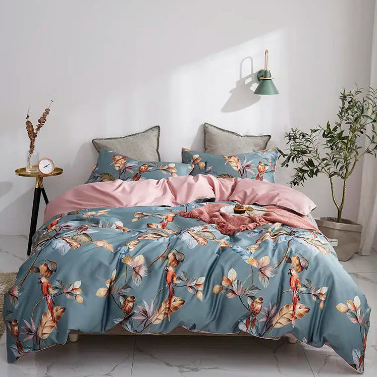 Dusty blue tropical parrot duvet cover set with blush pink bedding and botanical branches – L&B