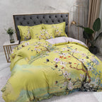 Yellow Egyptian cotton bedding with painterly tree branches and spring blossoms in an artistic bedroom – L&B