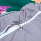 Hidden zipper closure detail on the coordinating gray reverse of the green floral duvet cover – L&B