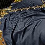 Close-up of black Egyptian cotton bedding with delicate gold embroidered trim, PERIK – L&B