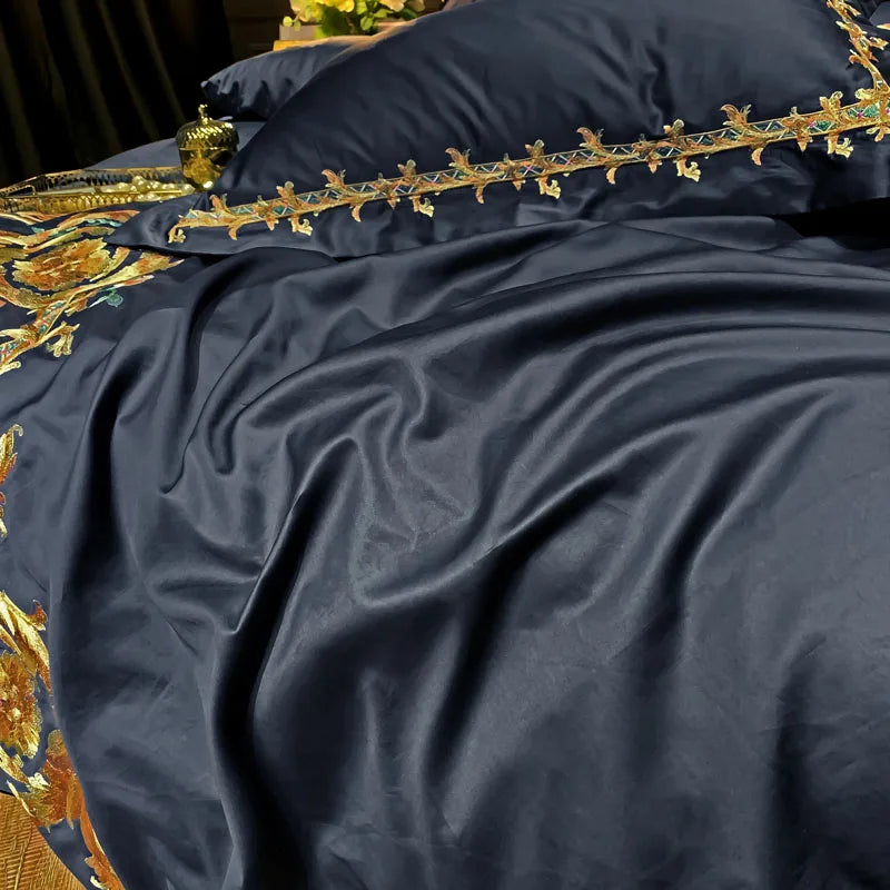 Close-up of black Egyptian cotton bedding with delicate gold embroidered trim, PERIK – L&B