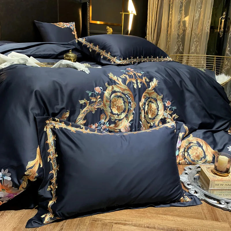 Black accent pillow layered over gold baroque floral embroidered bedding, PERIK – L&B