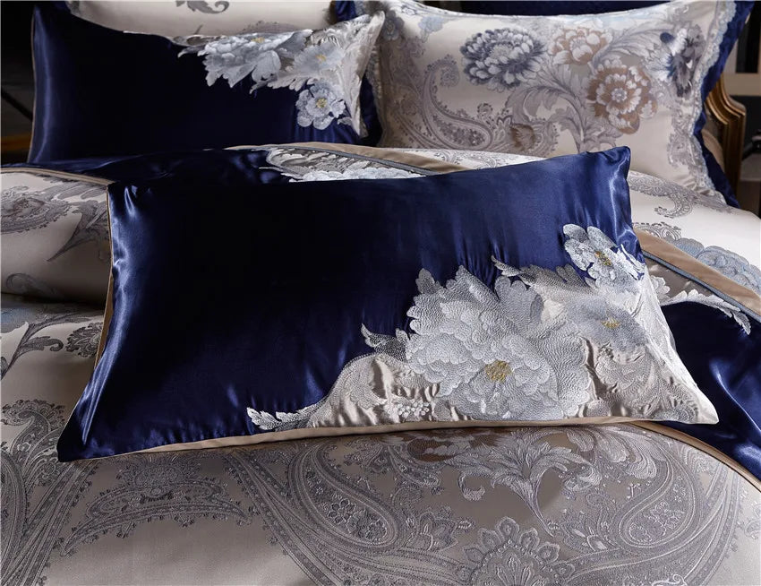 Royal blue accent pillow layered with champagne embroidered pillow shams, STOPIAK – L&B