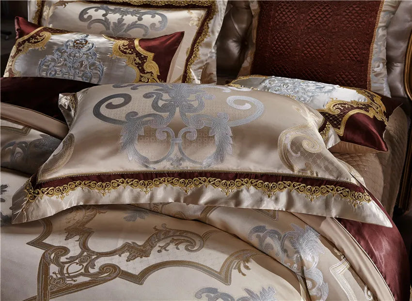 Close view of champagne gold embroidered duvet cover and coordinating pillow shams, SPECTO – L&B