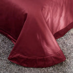 Coordinating solid burgundy flat sheet with a smooth tailored hem, ZUTAPERA – L&B