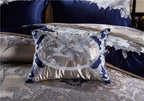 Layered royal blue and champagne embroidered pillow shams with ornate trim, STOPIAK – L&B