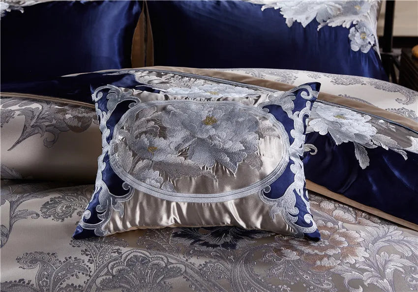 Layered royal blue and champagne embroidered pillow shams with ornate trim, STOPIAK – L&B