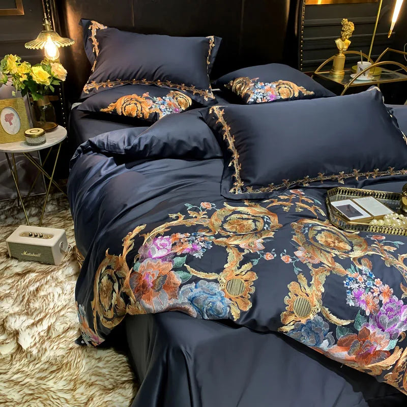 Close-up of blue, coral and gold floral embroidery on black bedding, PERIK – L&B