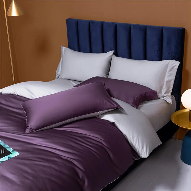 Plum purple bedding displayed with contrasting silver gray shams in a contemporary bedroom – NESLLA PURPLE GREY – L&B