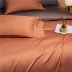 Terracotta Egyptian cotton pillowcases layered with deep brown shams on a reversible bedding set – NESLLA ORANGE BROWN – L&B