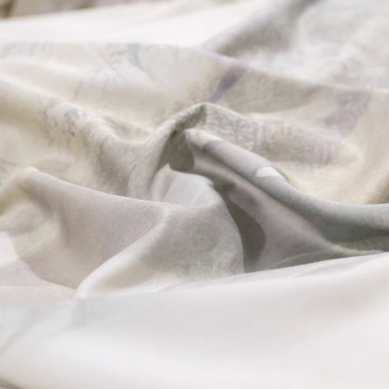 Close-up of smooth ivory 600TC Egyptian cotton fabric with a softly lustrous drape – L&B