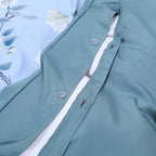 Button closure detail on the matching sky blue reverse of the LIGHT SKYRA duvet cover – L&B