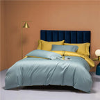 Sky blue bedding set styled with sunny yellow pillows and a navy upholstered headboard – NESLLA SKY-BLUE YELLOW – L&B
