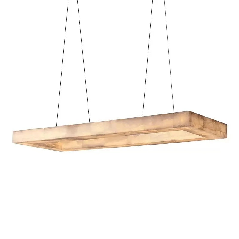 Rectangular alabaster linear chandelier with a gold canopy isolated on a white background