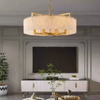 Alabaster drum chandelier with a gold frame in modern living room