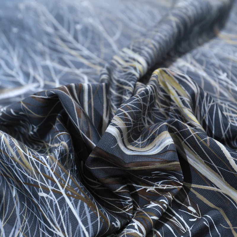 Close-up of the DARK FOREST duvet cover with white winter branches and flying bird details – L&B