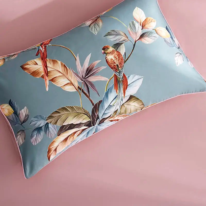 Dusty blue tropical parrot pillow sham with coral flowers and painterly botanical branches – L&B