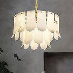 2-tier alabaster statement chandelier with sculptural petal panels in a modern living room - L&B
