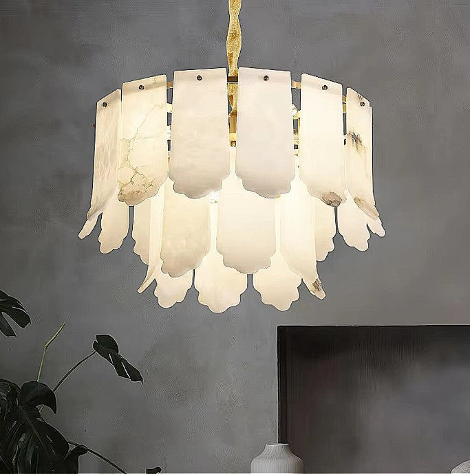 Sculptural alabaster petal chandelier with layered tiers and a gold frame in a modern living room - L&B