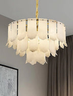 Tiered alabaster panel chandelier in a warm modern interior with a gold frame - L&B