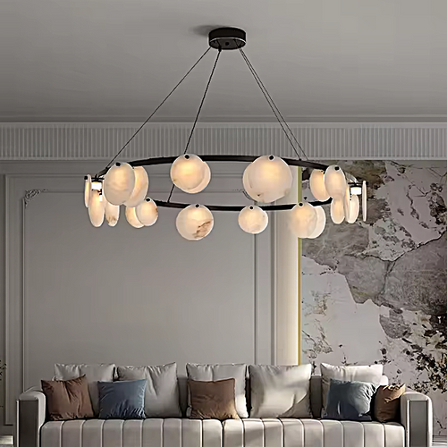 Modern alabaster disc ring chandelier with a black frame in a contemporary living room - L&B