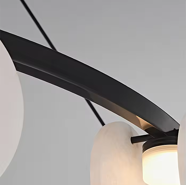 Black metal ring frame detail of a modern alabaster disc chandelier - L&B