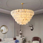 Cascading alabaster disc chandelier in a modern neoclassical living room with decorative wall molding - L&B