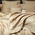 Champagne gold abstract geometric duvet cover with fluid drape and coordinating pillows, LUSTRA GOLD – L&B