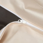 Close-up of the concealed zipper closure on the smooth ivory reverse of the black floral duvet cover – L&B