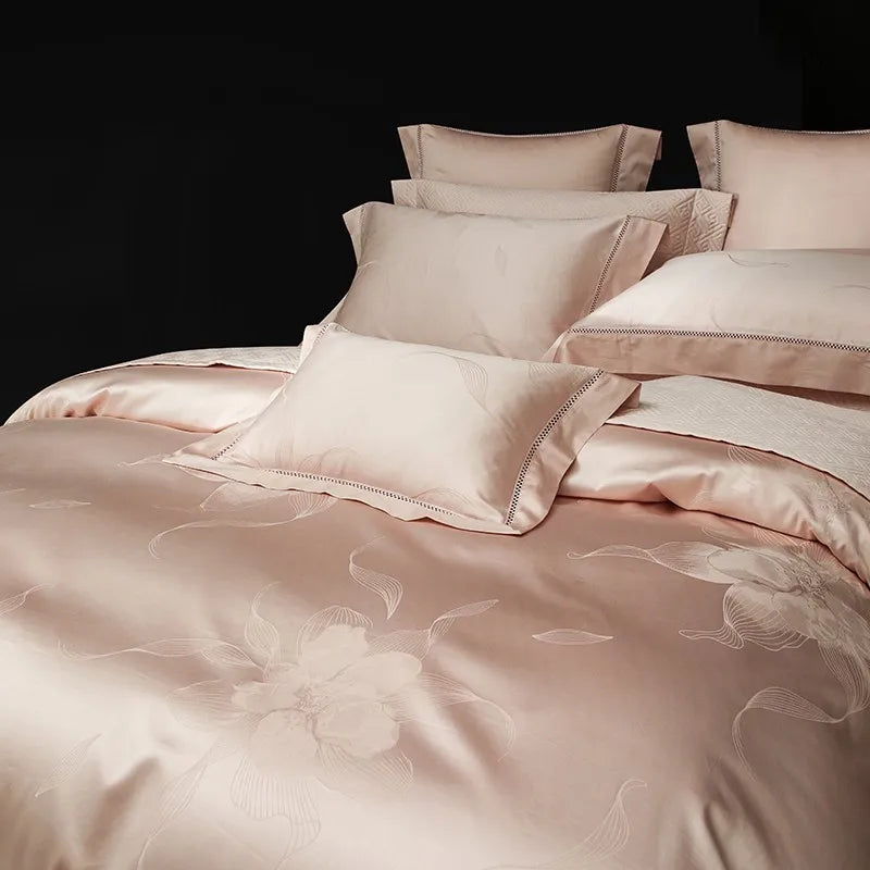 Close bedroom view of blush floral jacquard duvet cover and decorative pillows, LUSTRA BLUSH – L&B