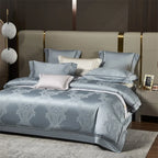 Light blue luxury bedding set styled with a damask jacquard duvet cover and coordinating decorative pillows – L&B