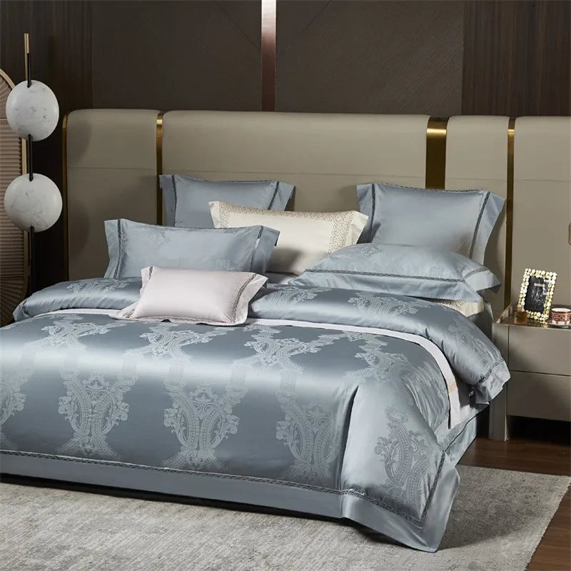 Light blue luxury bedding set styled with a damask jacquard duvet cover and coordinating decorative pillows – L&B