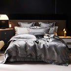 Charcoal gray jacquard duvet cover set with platinum threadwork, layered shams, and a rich metallic finish – L&B